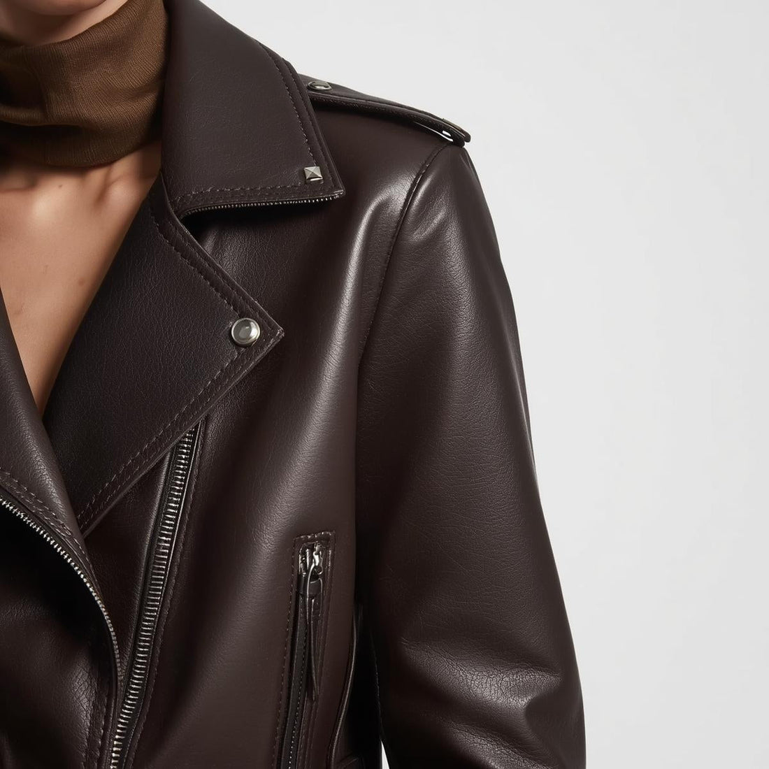 A focused shot on shoulders of model wearing Dark brown Leather jacket  