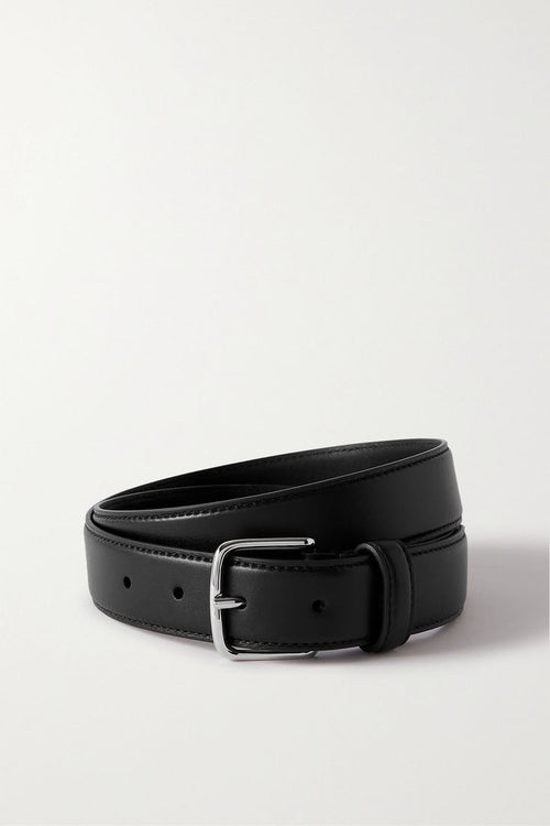 Black leather belt with a silver buckle on a light gray background